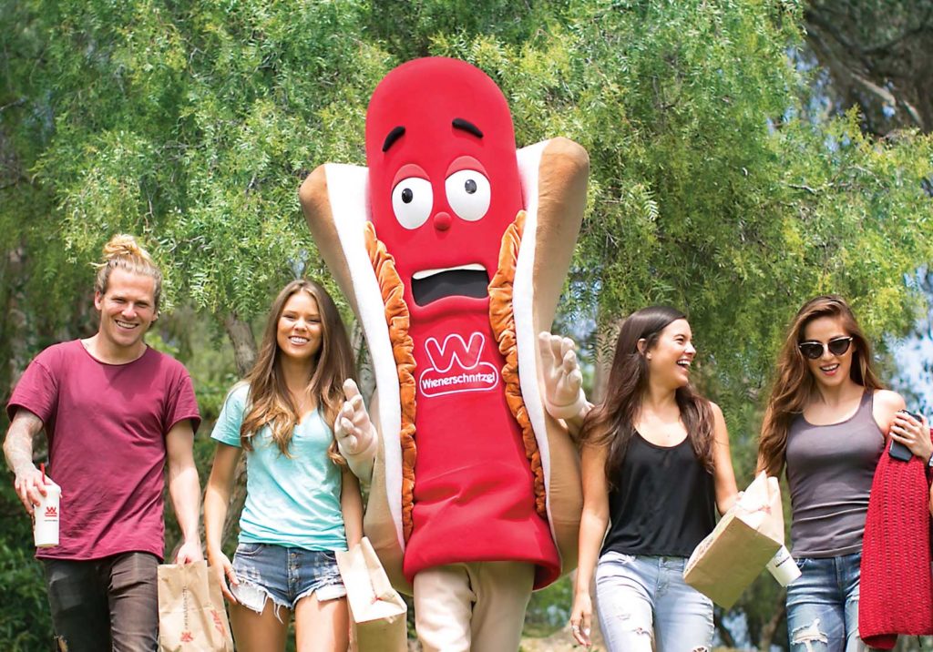 Wienerschnitzel hot dog franchise Mascot with teens