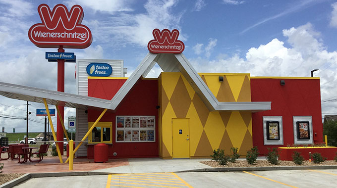 Wienerschnitzel hot dog franchise and Tastee Freez A-frame style restaurant from the outside